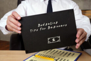 Budgeting Tips For Beginners with inscription on the piece of paper.