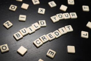 Build Your Credit Concept tiles on a dark background