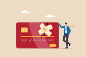 Cartoon standing with a credit card with bandage representing credit repair.